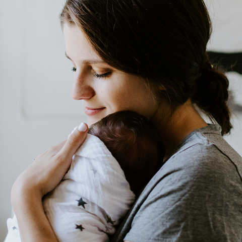 mother holding baby