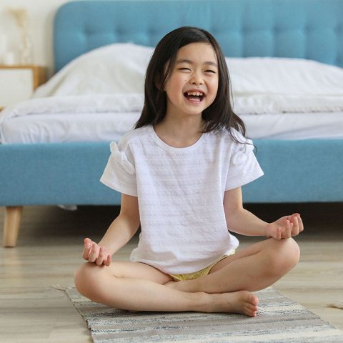 kid doing yoga