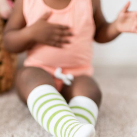 toddlers exploring their bodies