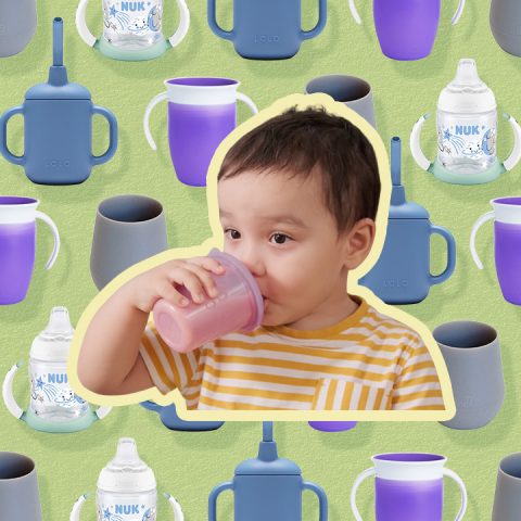 toddler drinking out of cups with cups behind