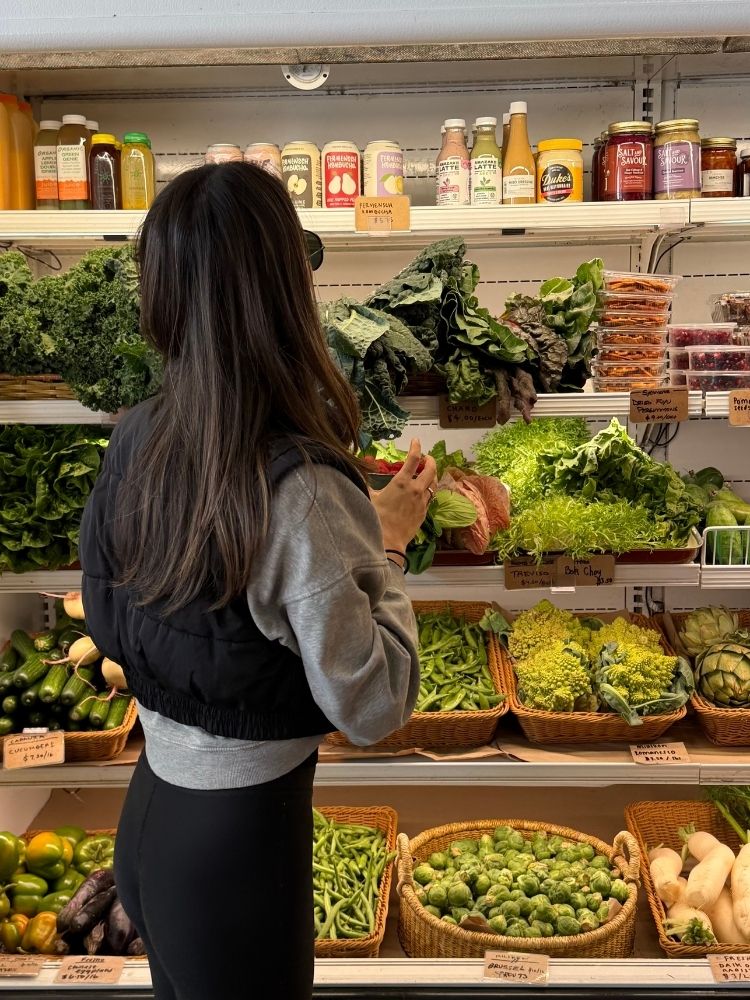 mom grocery shopping while listening to audiobook