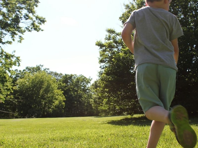 boy running in a field
