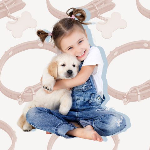 young girl holding dog