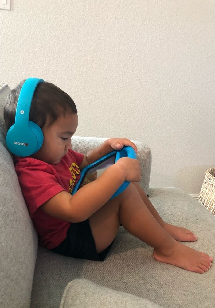 little kid listening to podcast