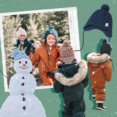 kids playing in snowsuits. snowman & hat