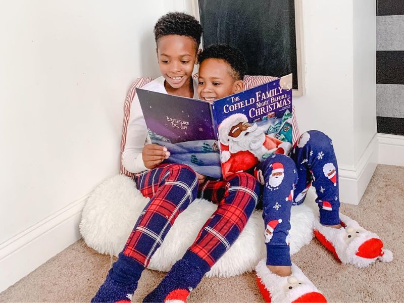 kids reading book about santa