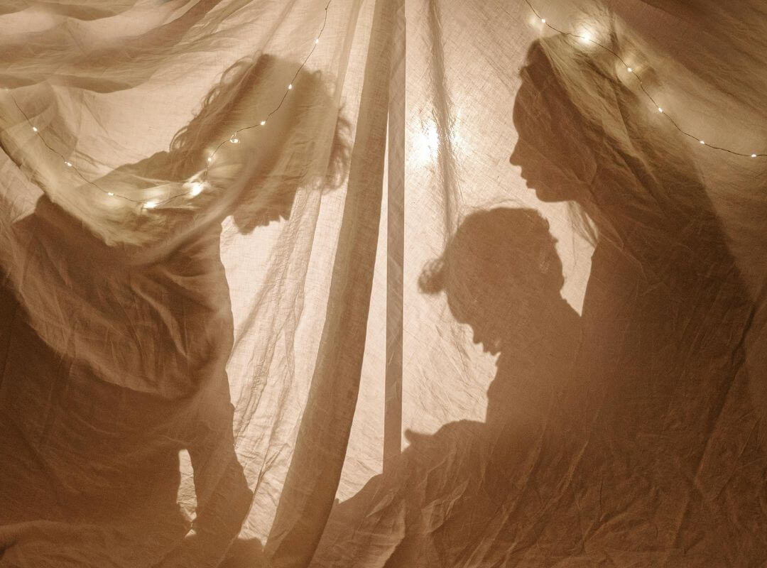 family in blanket fort