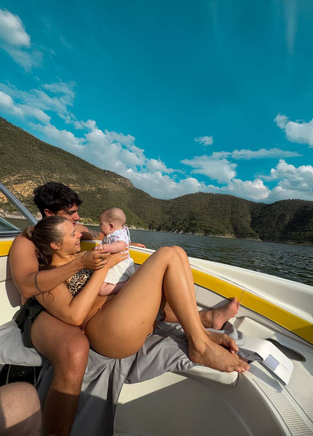 parents with baby on boat