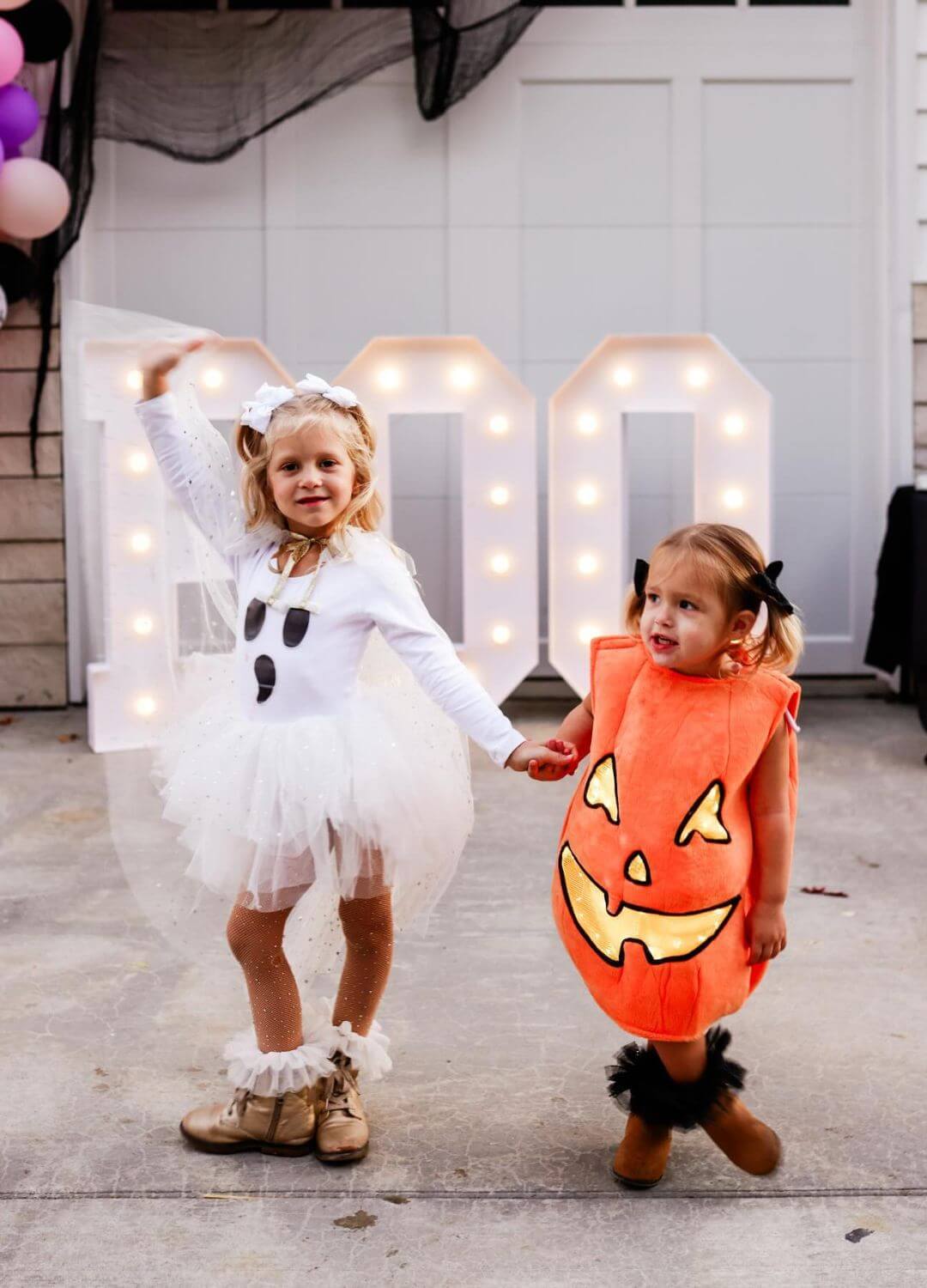 two girls in halloween costumes