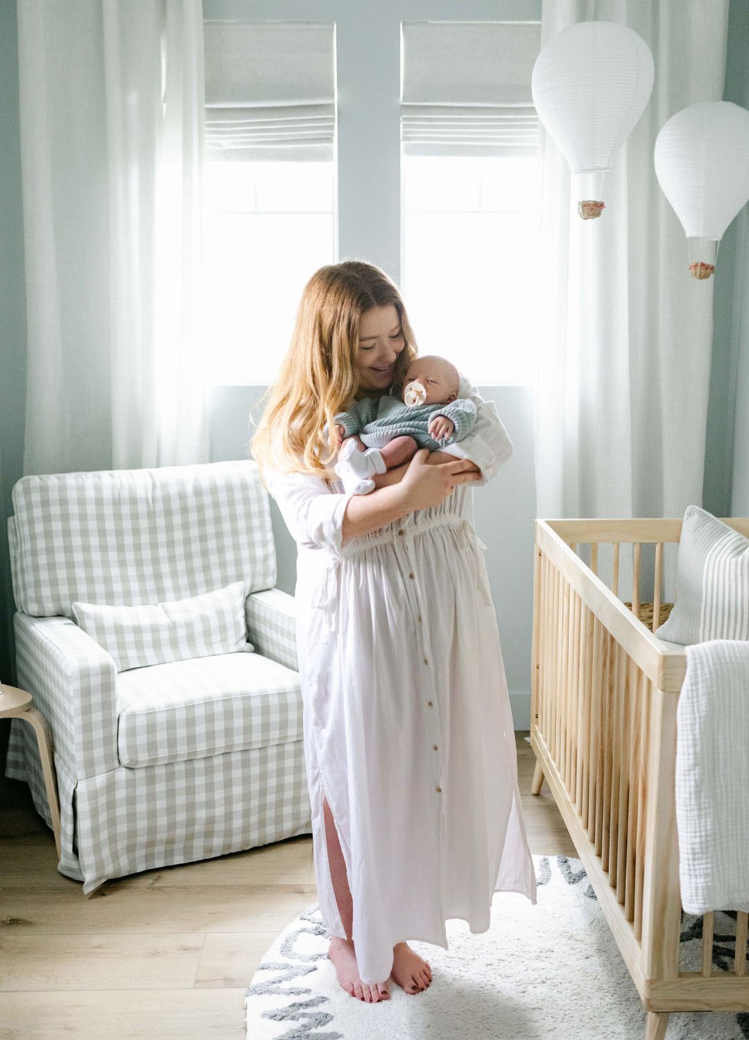 mom and baby boy in vintage nursery