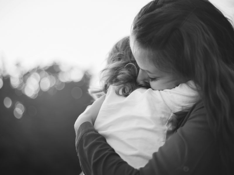 mom hugging child