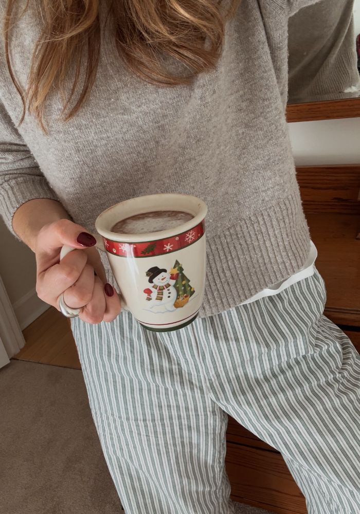 woman holding holiday coffee cup
