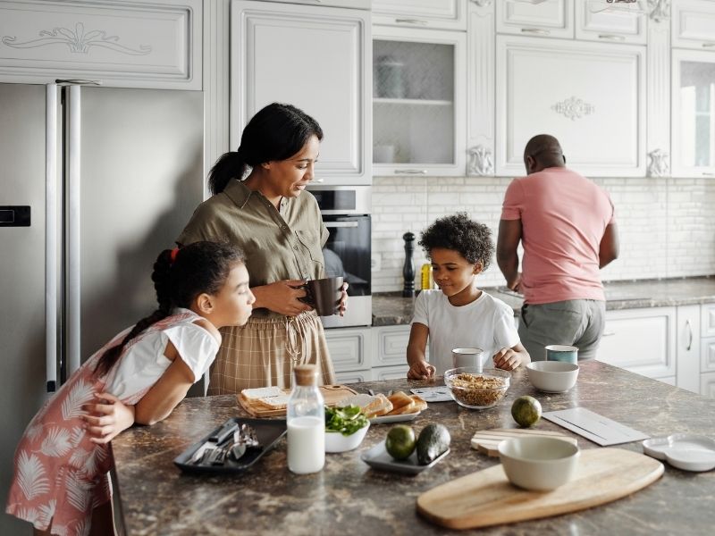 family eating and preparing food together