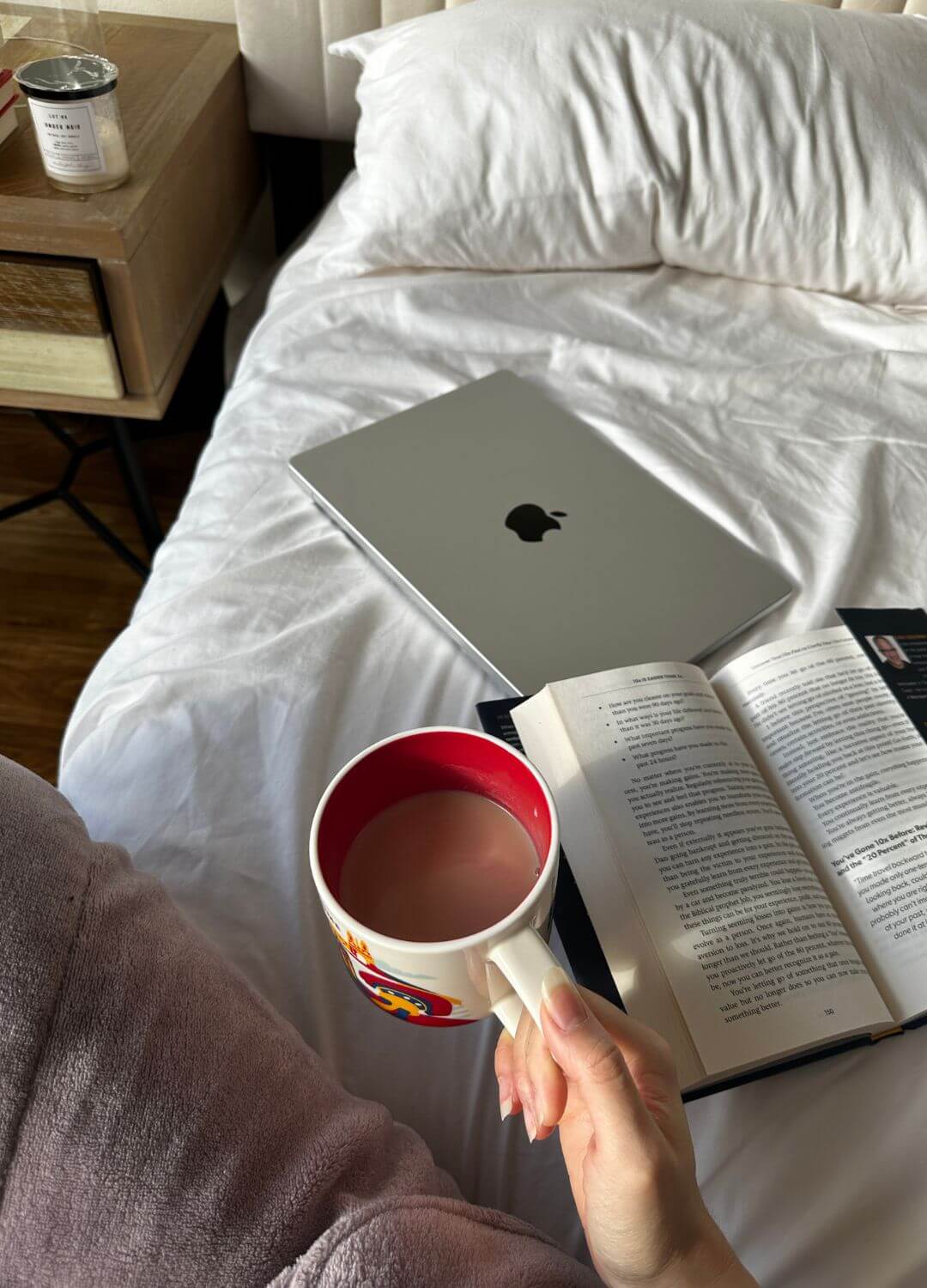 coffee and book on bed