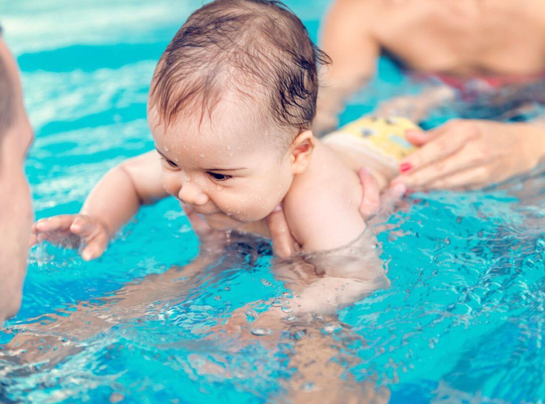 baby swimming in pool