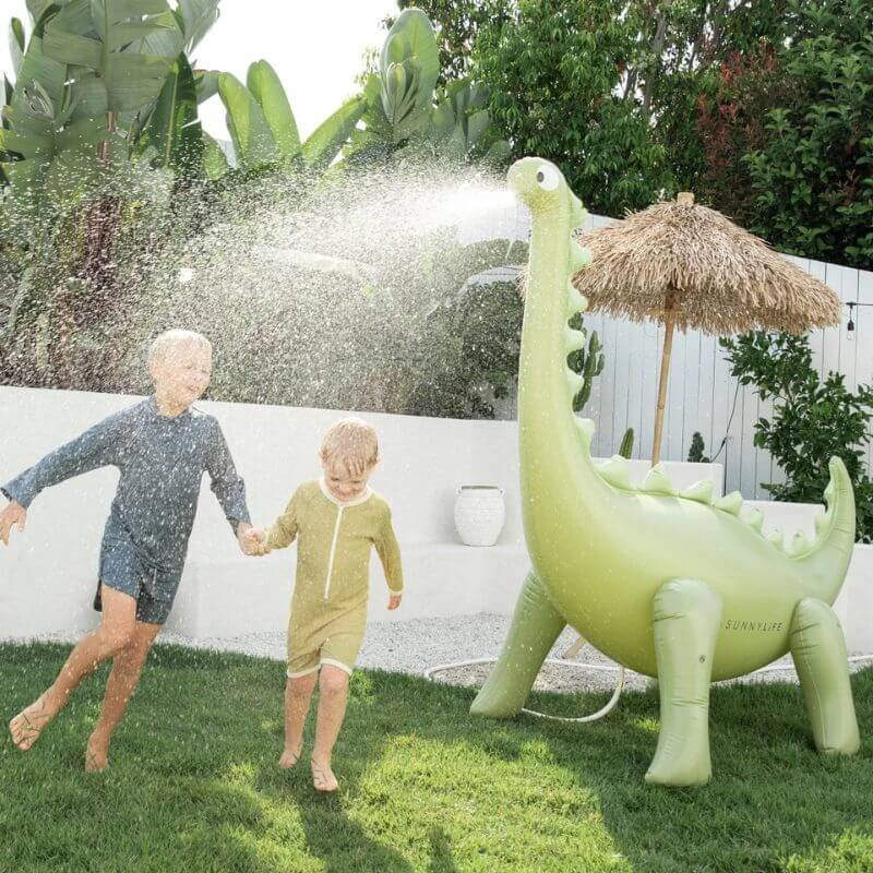 kids playing in sprinkler