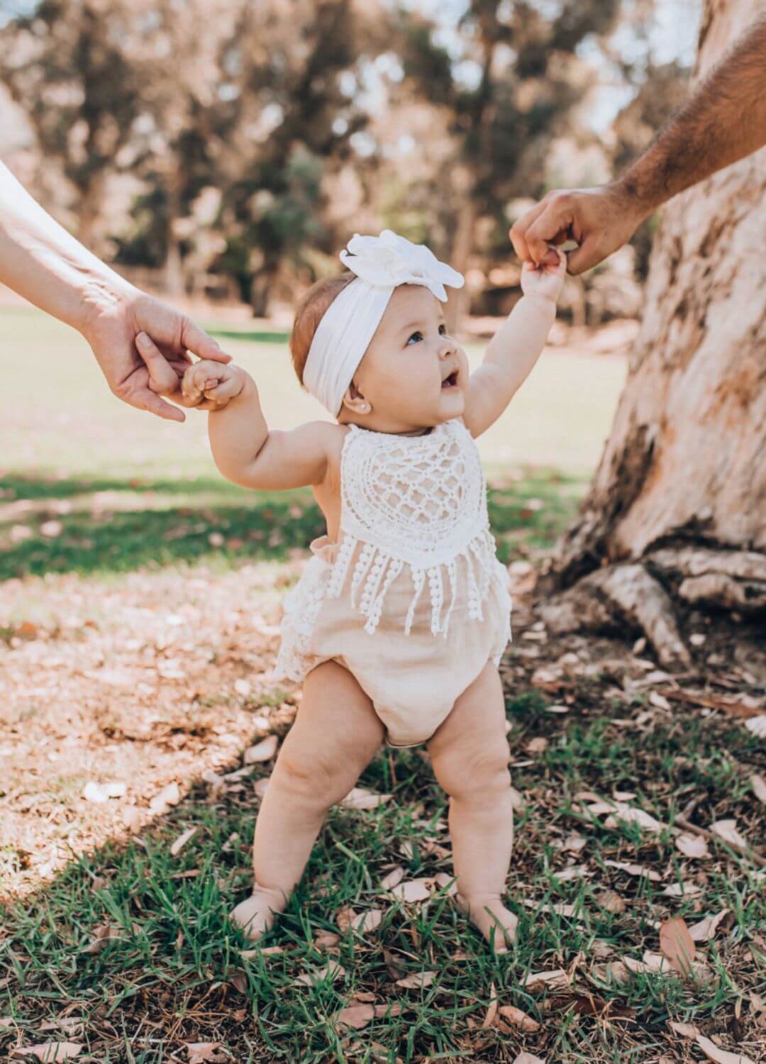 baby standing in grass