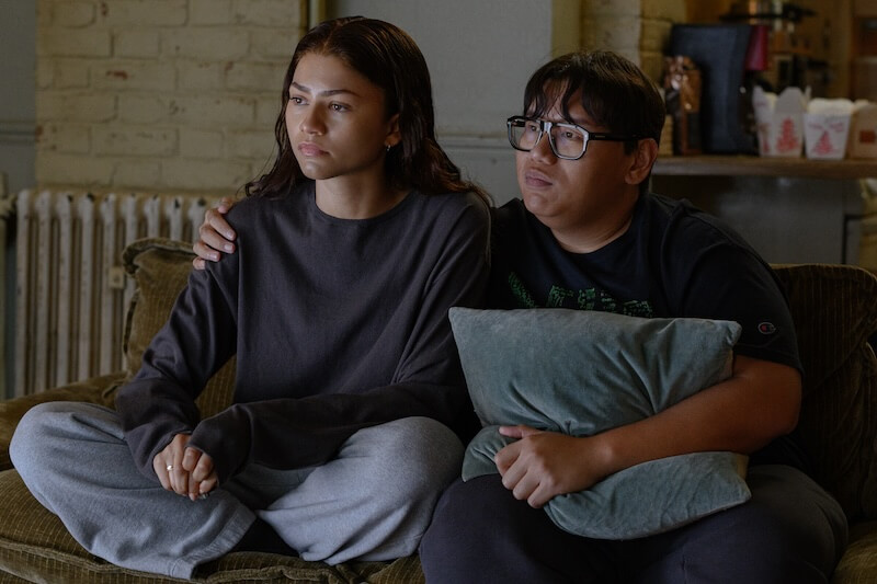 mj and ned sitting on the couch
