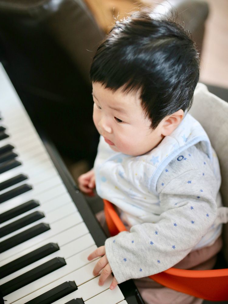 baby playing piano