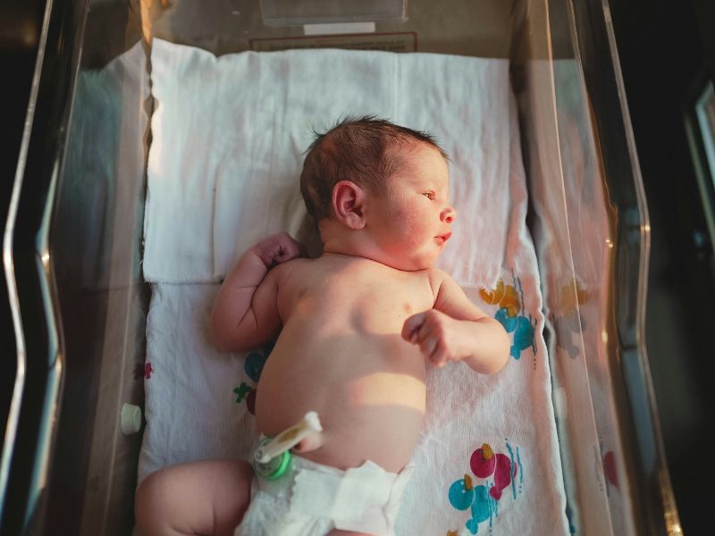 newborn in bassinet childhood vaccines