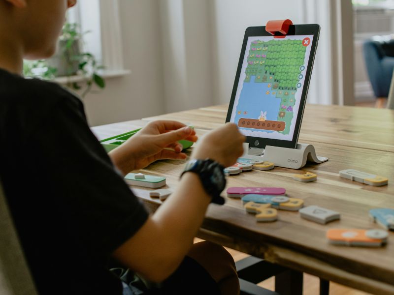 kid learning on tablet