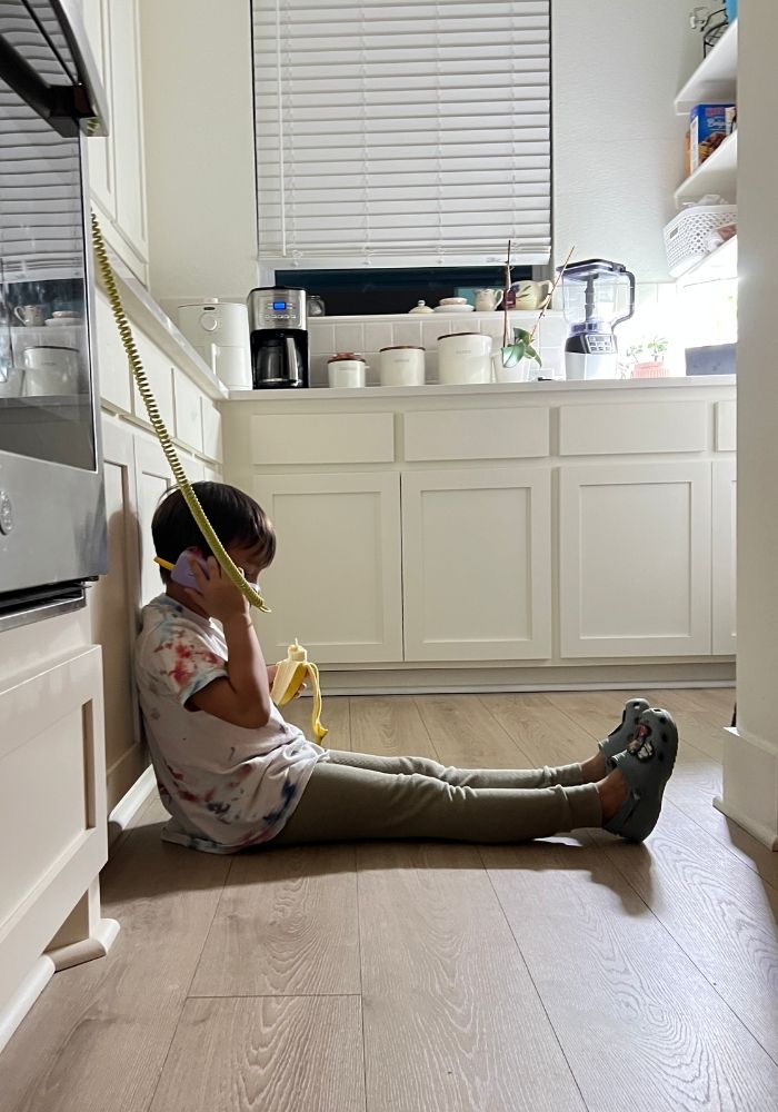 kid talking on waffle home phone